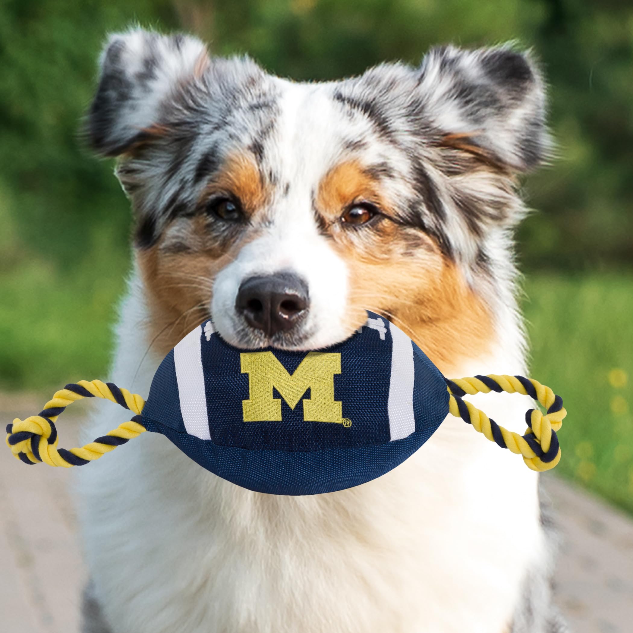 Pets First NCAA Michigan Wolverines Football Dog Toy, Tough Quality Nylon Materials, Strong Pull Ropes, Inner Squeaker, Collegia