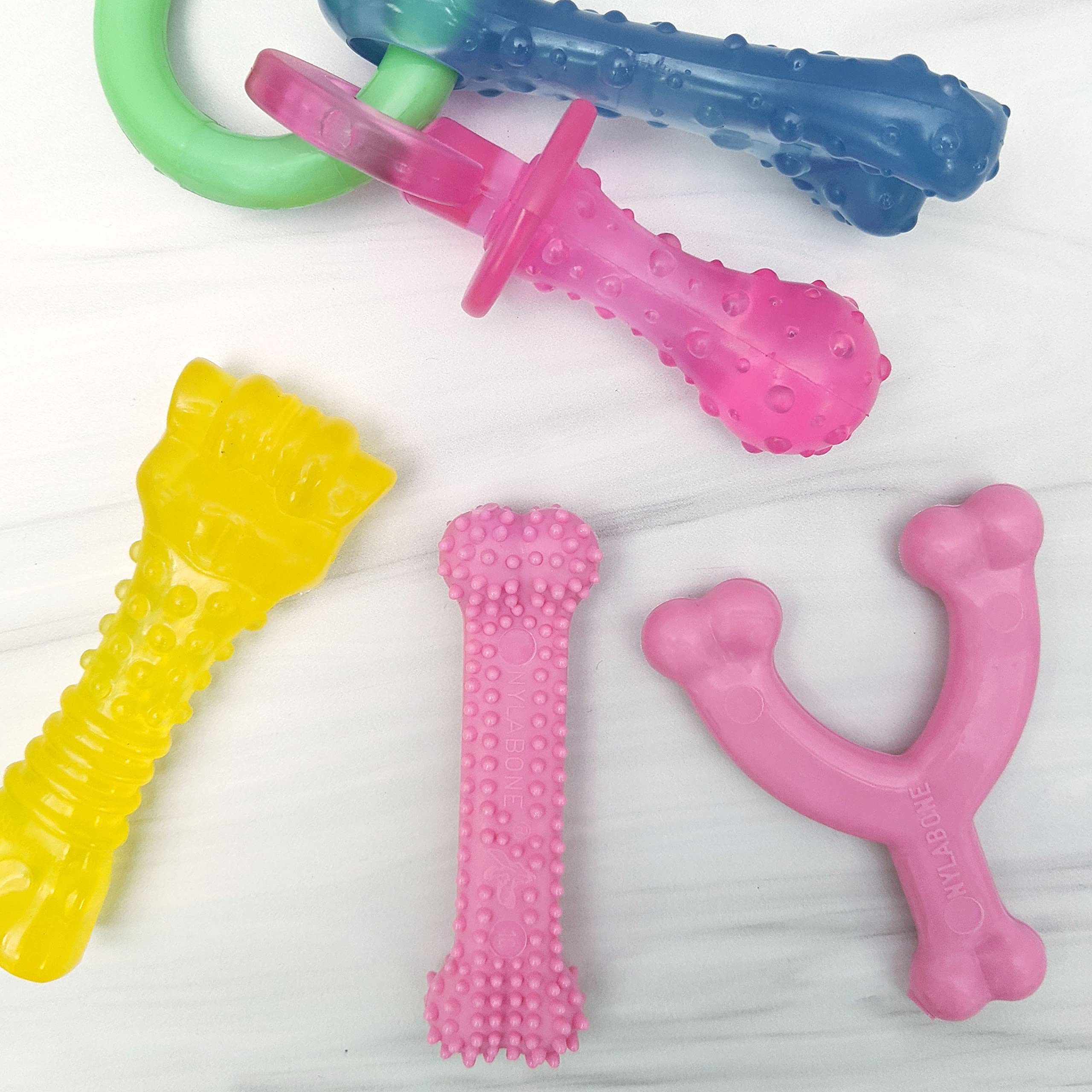 Nylabone New Puppy Chew Toy Bundle, Toys for Teething Puppies, Chicken & Bacon Flavors, Pink, X-Small - Up to 15 lbs, 4 Pack